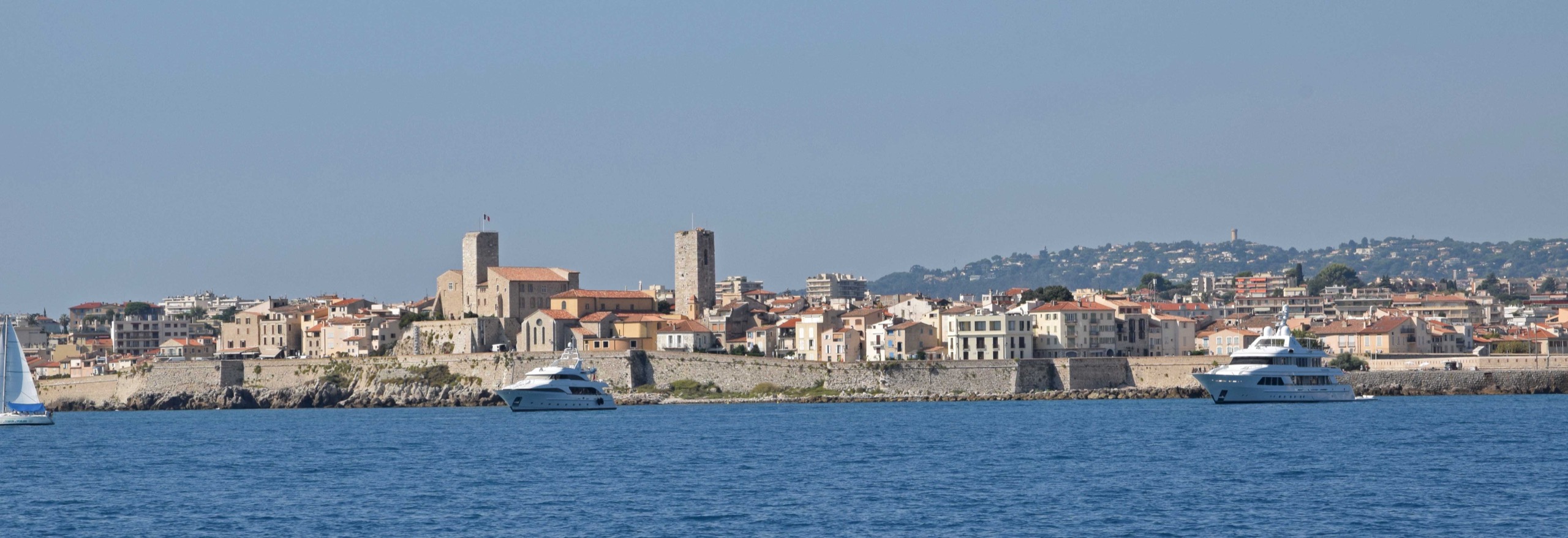 Antibes old town and its stone ramparts seen across the Mediterranean Sea